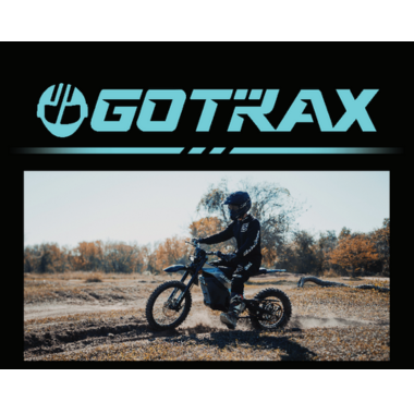 Rider on electric dirt bike outdoors.